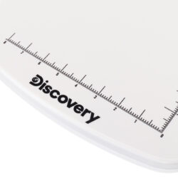 Biała podstawa mikroskopu Discovery z nadrukowaną podziałką centymetrową.