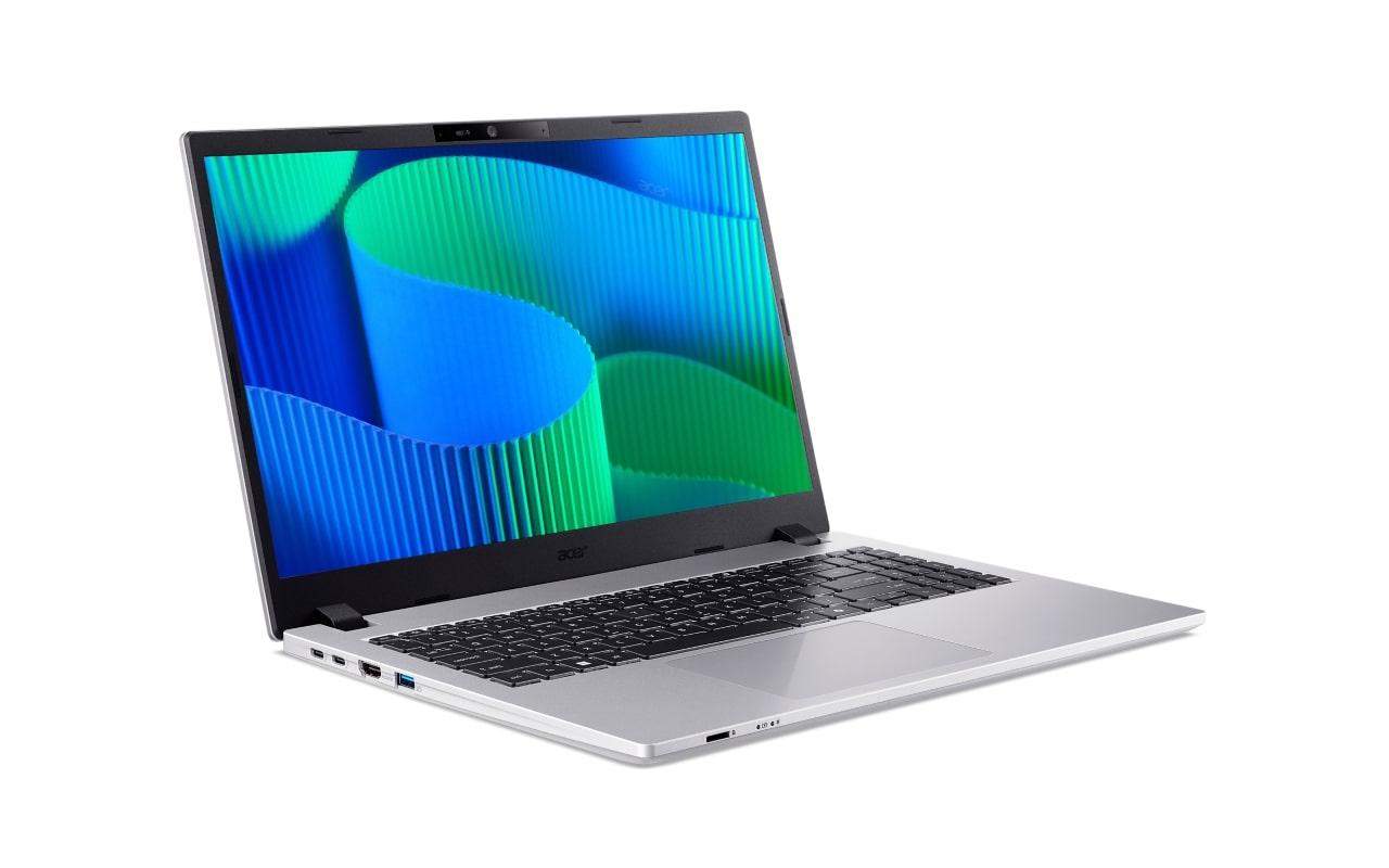 Srebrny laptop Acer z otwartą klapą i abstrakcyjną tapetą na ekranie.