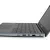 Widok z boku na otwarty laptop NTT Book z widocznymi portami USB, czytnikiem kart i złączem audio.